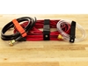 12 x 1 Inch Orange Cinch Strap with Eyelet securing cables, hoses, and tubing
